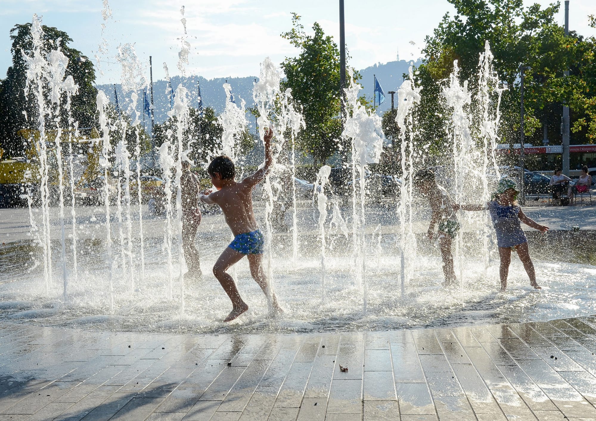 children playing in fountain