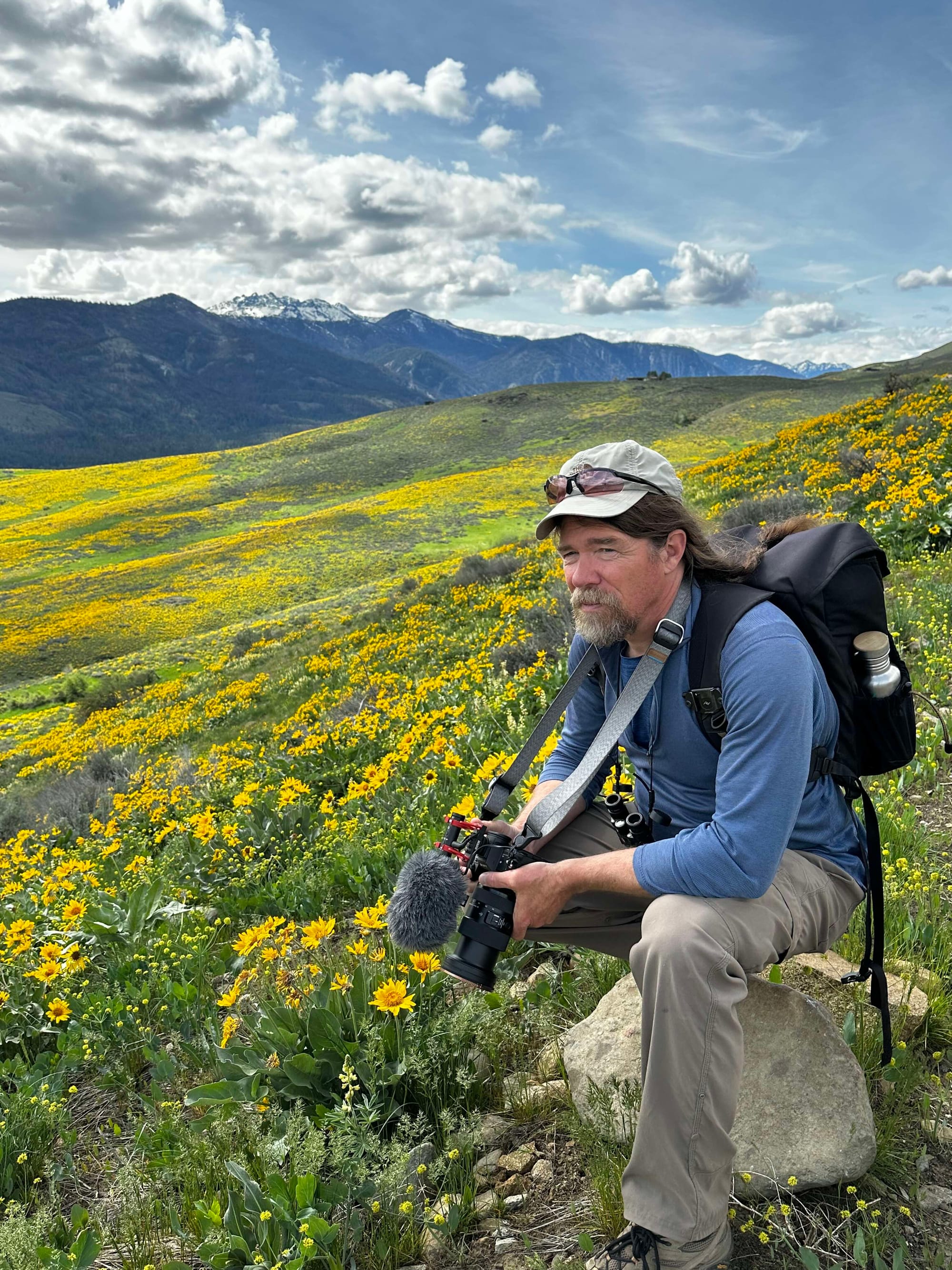 David Lukas amid flowers