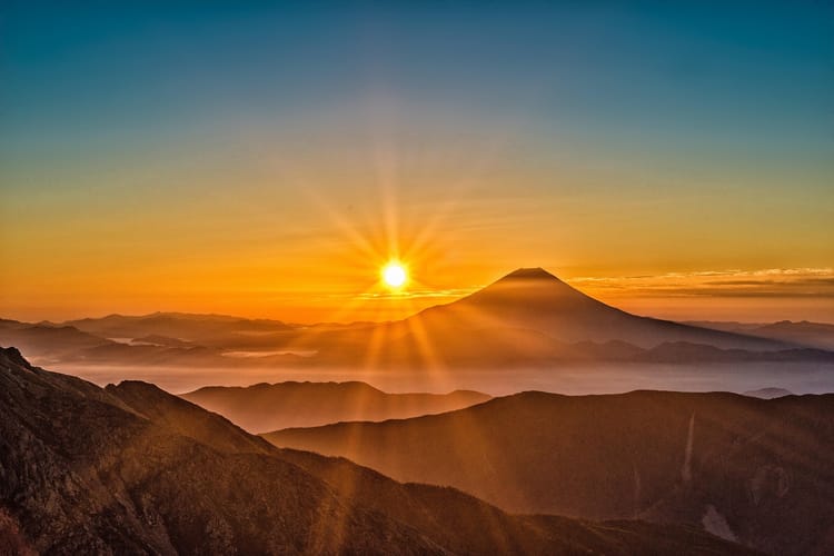 sun behind Mt.Fuji